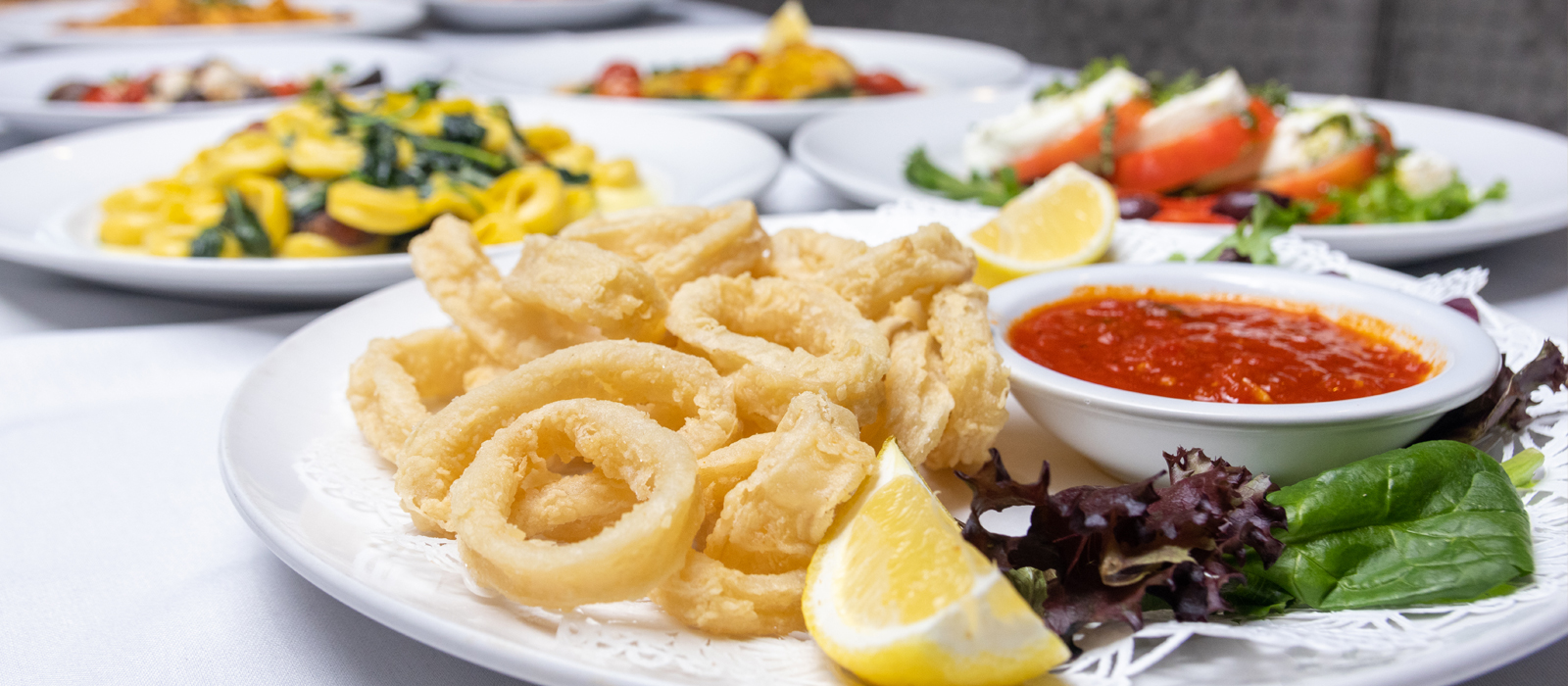 FRIED OR SPICY CALAMARI Choice of fried calamari served with marinara sauce OR fried calamari tossed with honey, red wine, and cherry hot peppers